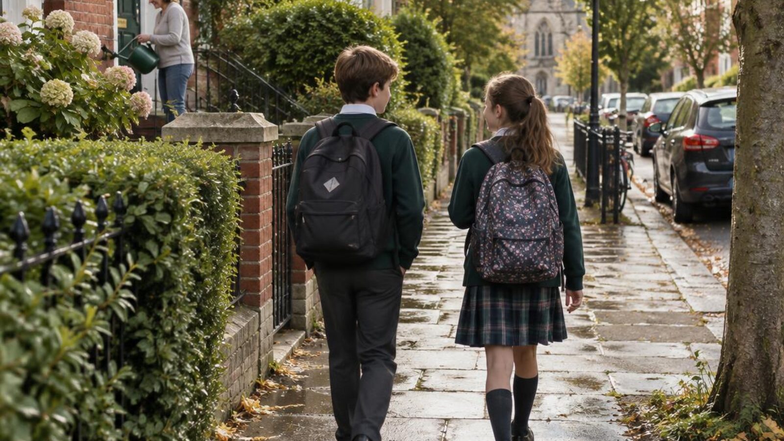 Children in school uniform walking to school along a leafy Irish street